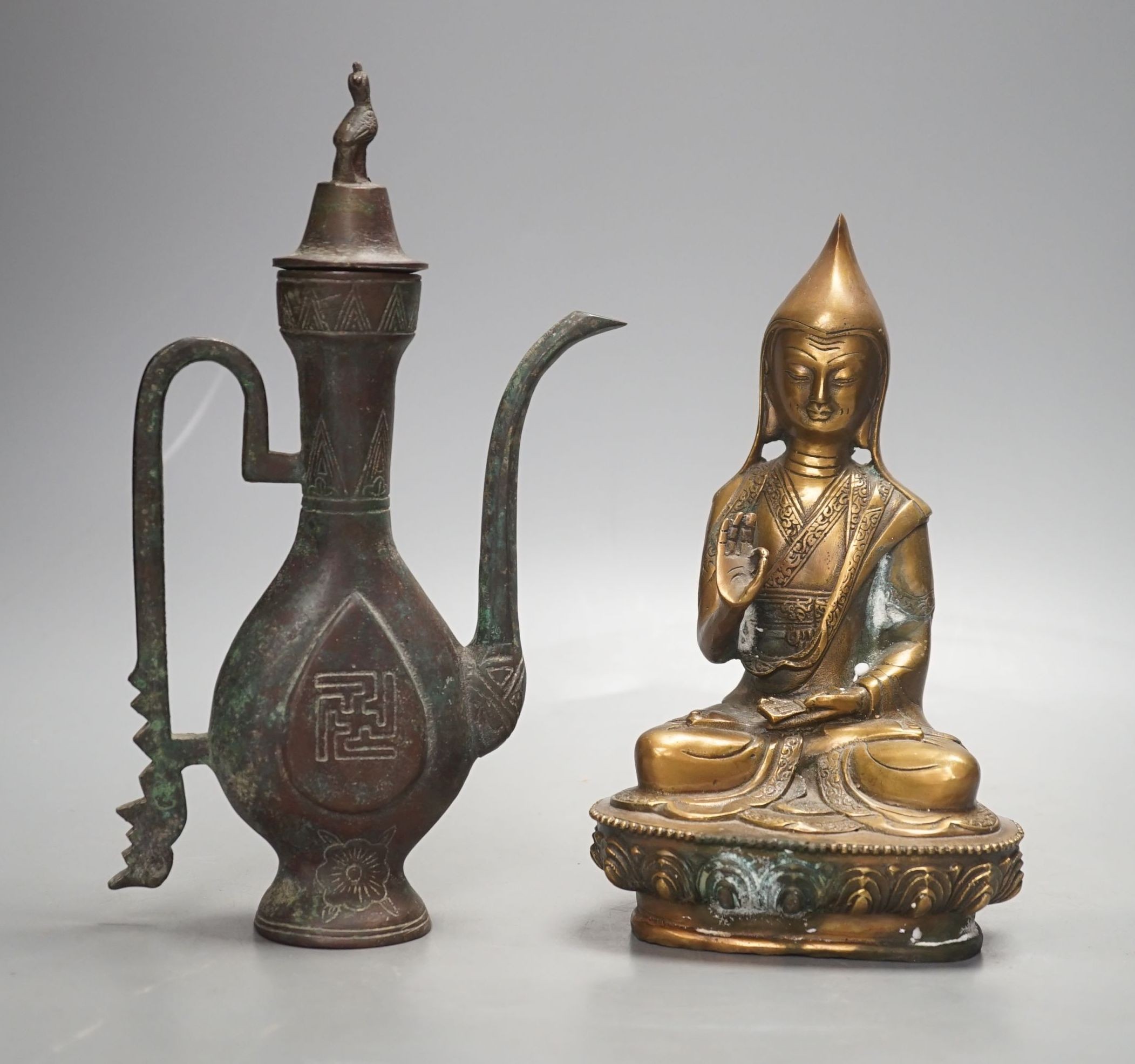 A Chinese bronze vessel and a bronze figure of a Dalai Lama, vessel 24 cms high.